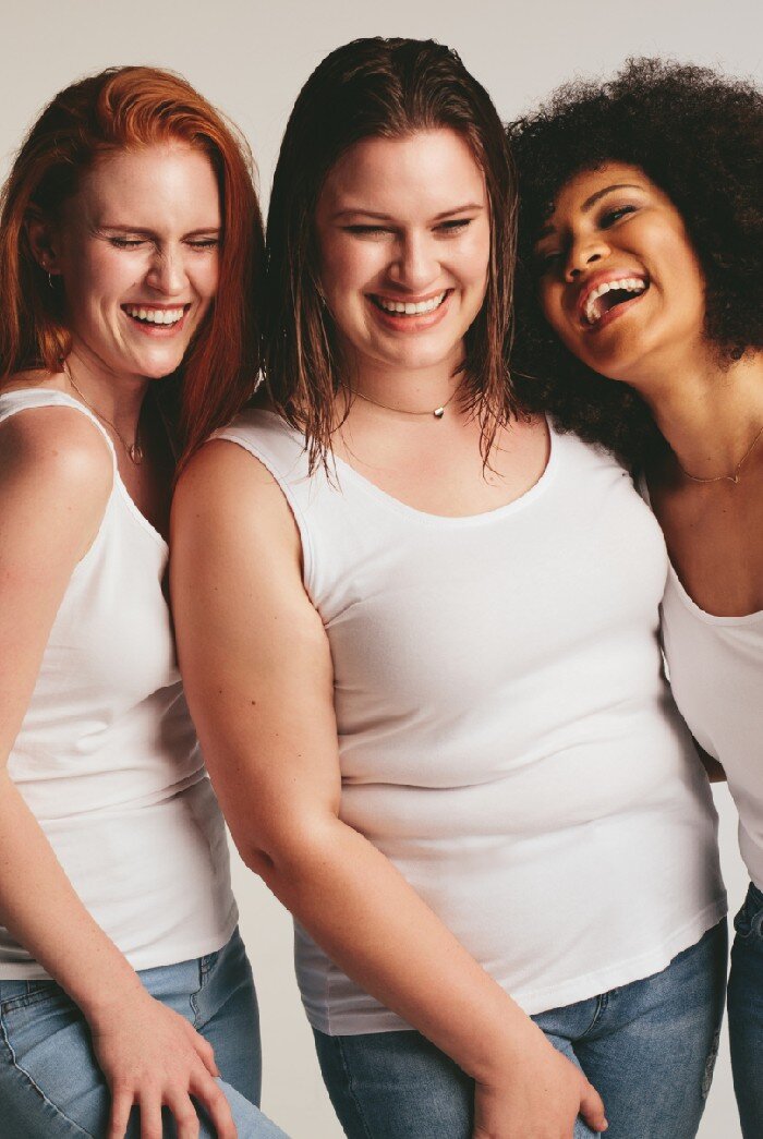 Chubby women wearing white sando sportswear standing at fitness studio.
